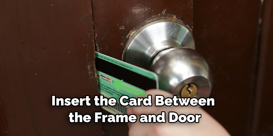 Insert the Card Between the Frame and Door