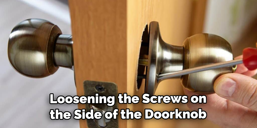 Loosening the Screws on the Side of the Doorknob
