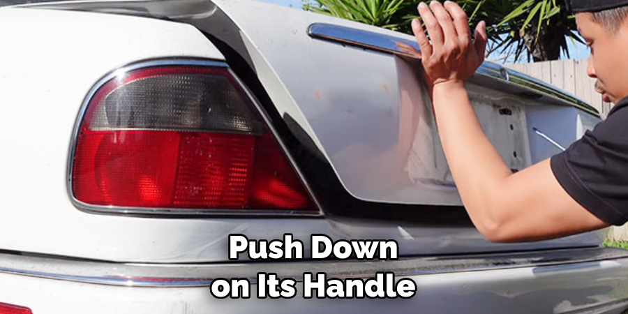  Push Down on Its Handle