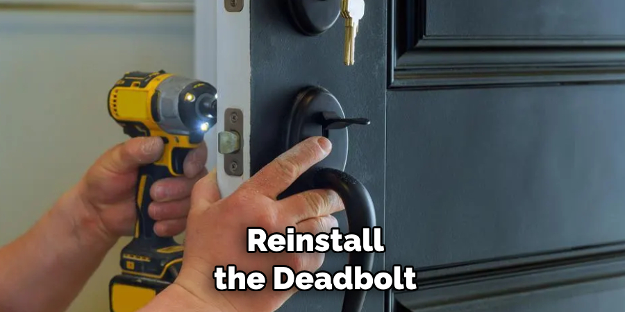  Reinstall the Deadbolt by Placing It 