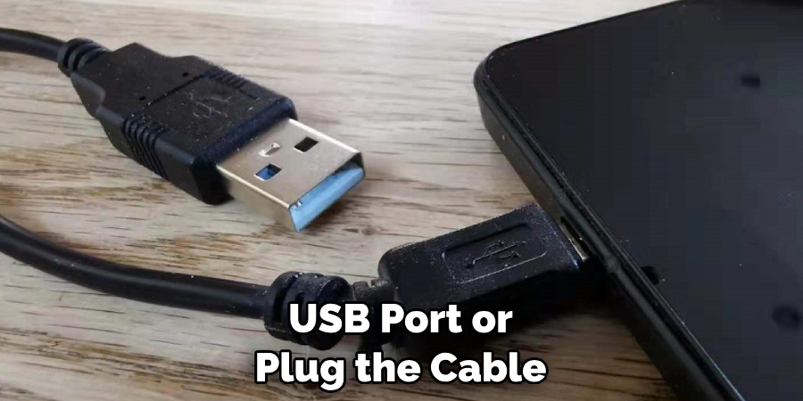 USB Port or Plug the Cable