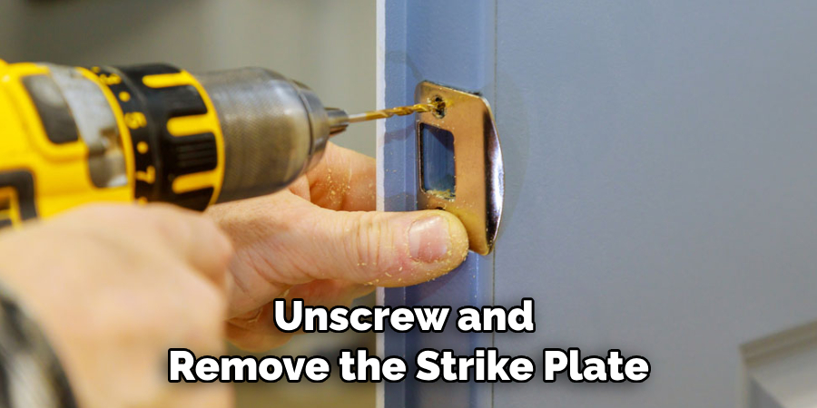 Unscrew and Remove the Strike Plate