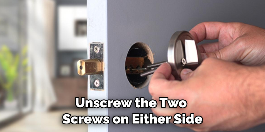 Unscrew the Two Screws on Either Side