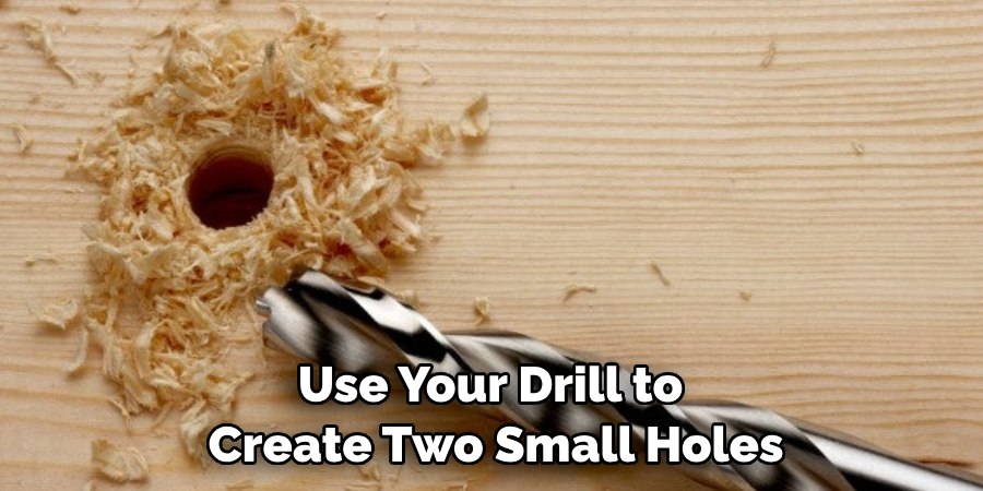 Use Your Drill to Create Two Small Holes