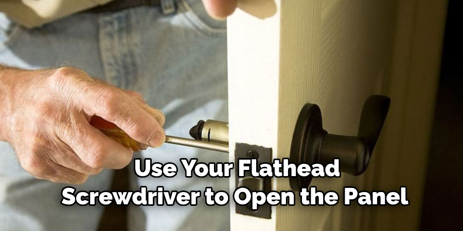  Use Your Flathead Screwdriver to Open the Panel 