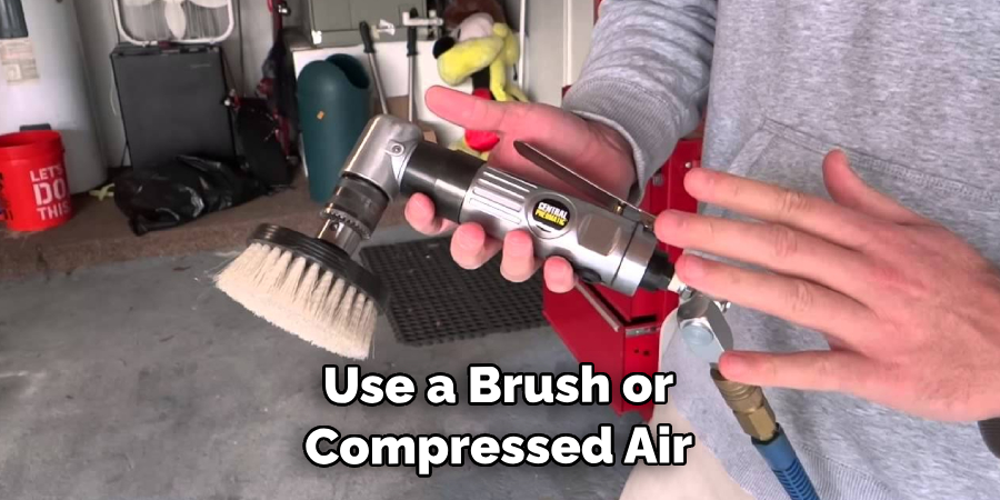 Use a Brush or Compressed Air