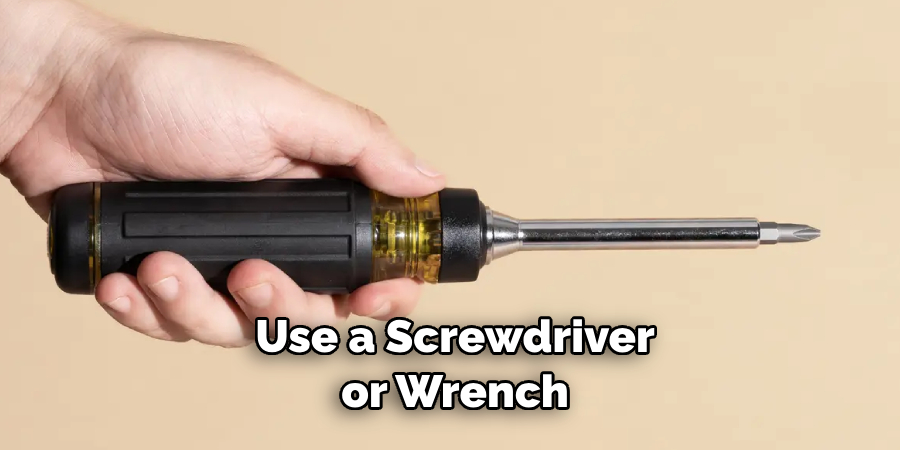  Use a Screwdriver or Wrench