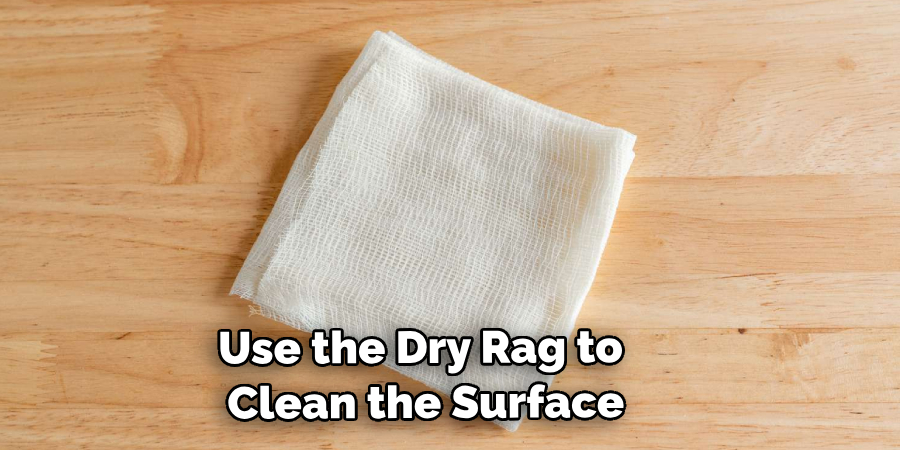 Use the dry rag to clean the surface