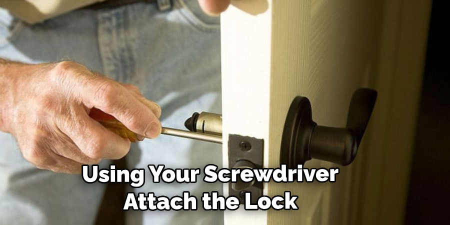 Using Your Screwdriver Attach the Lock
