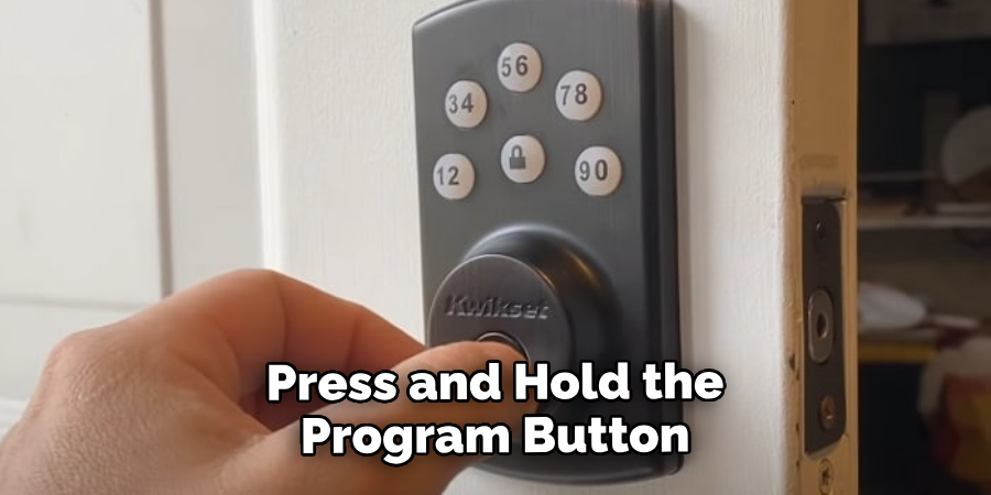 Press and Hold the Program Button