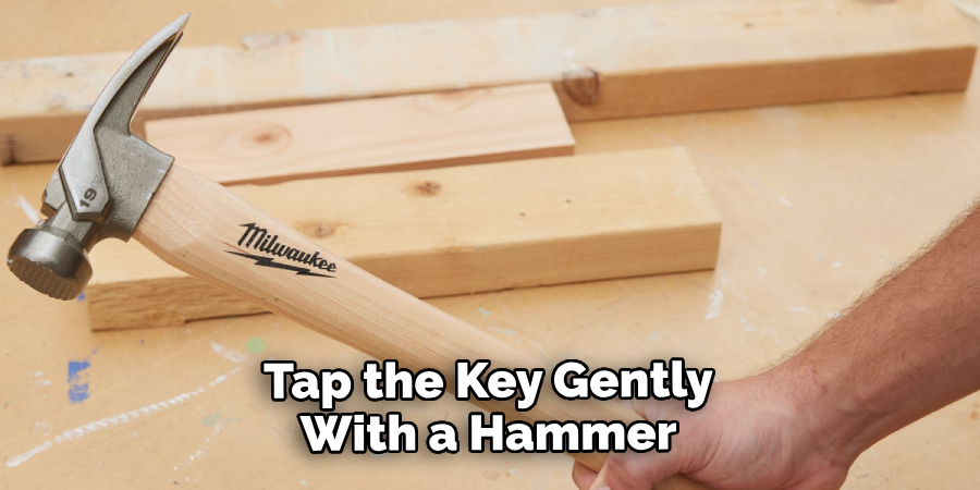 Tap the Key Gently With a Hammer