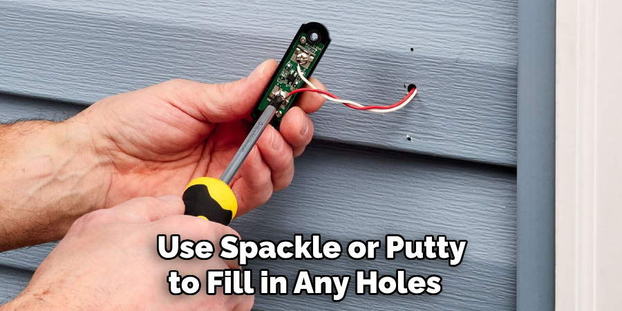  Use Spackle or Putty to Fill in Any Holes 