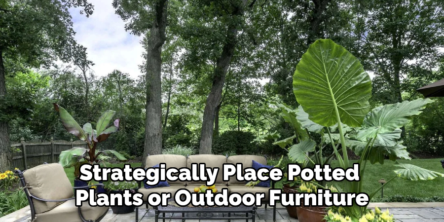 Strategically Place Potted Plants or Outdoor Furniture