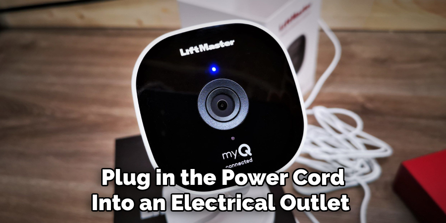 Plug in the Power Cord Into an Electrical Outlet 