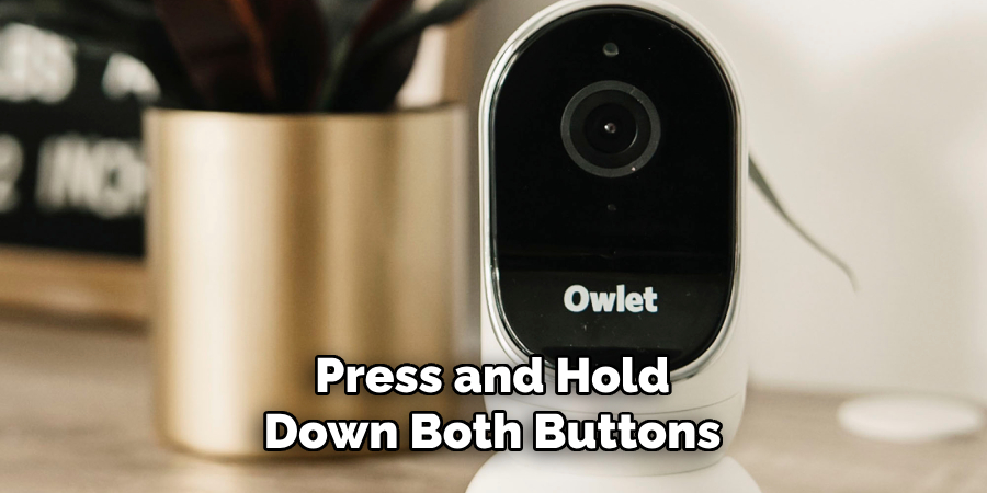 Press and Hold Down Both Buttons