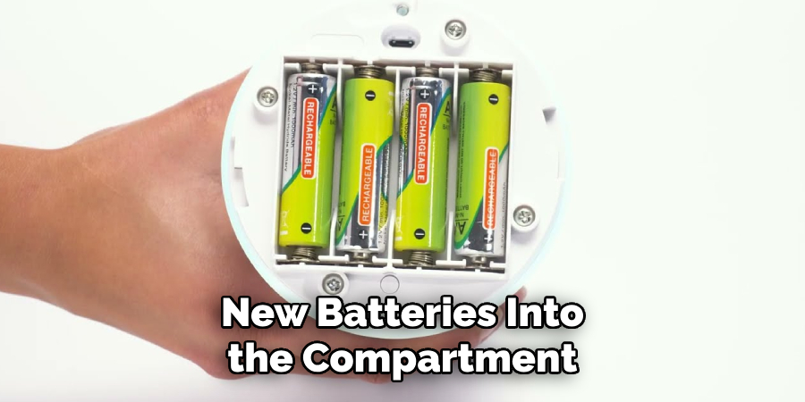 New Batteries Into the Compartment