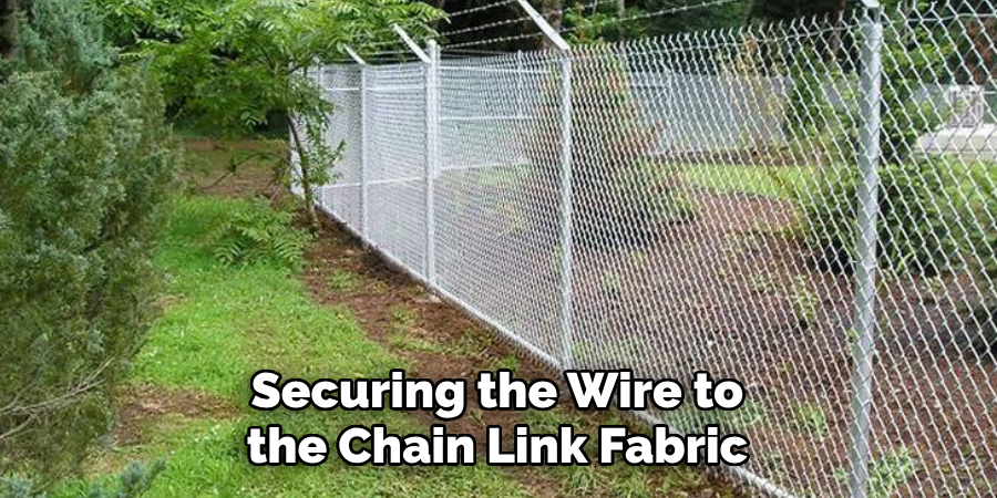 Securing the Wire to the Chain Link Fabric