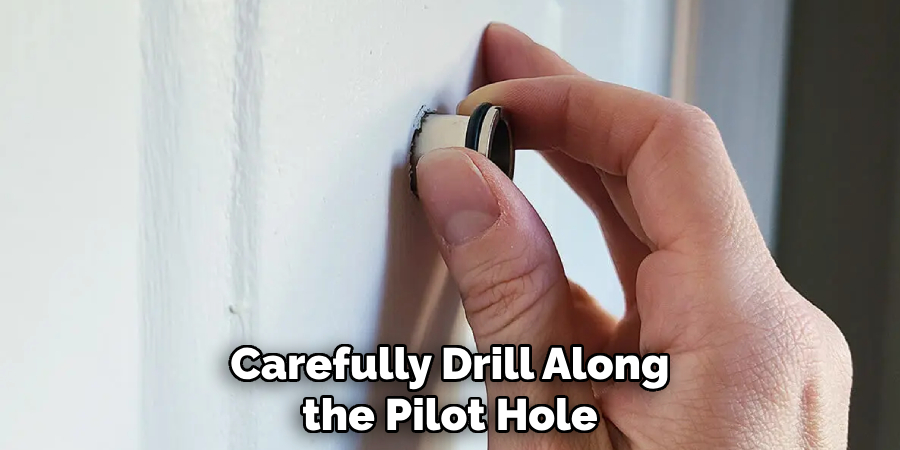 Carefully Drill Along the Pilot Hole