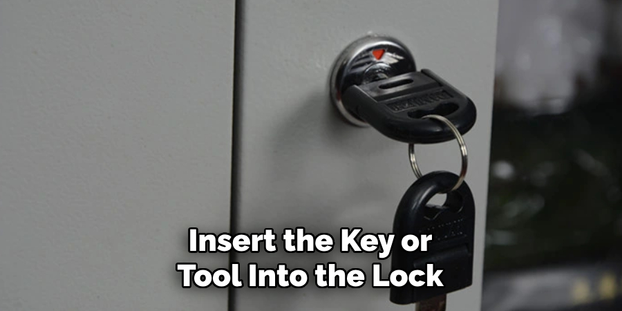 Insert the Key or
Tool Into the Lock