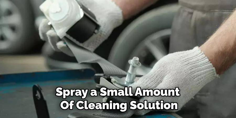 Spray a Small Amount 
Of Cleaning Solution