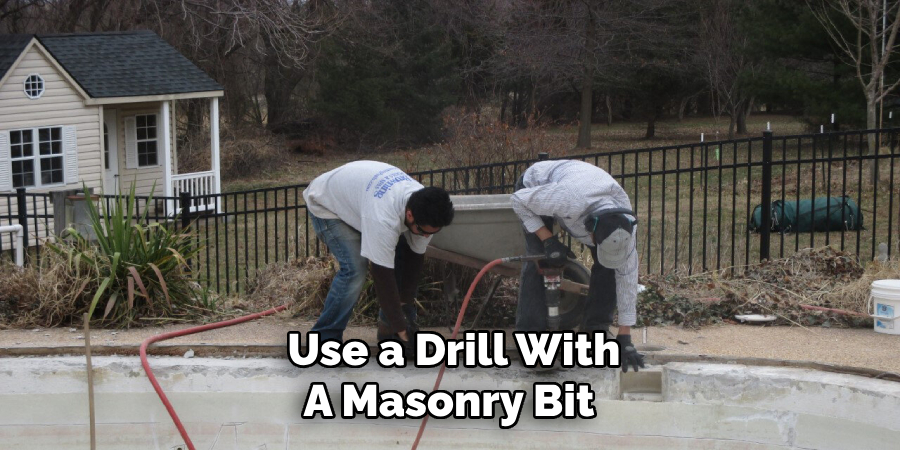 Use a Drill With
A Masonry Bit 