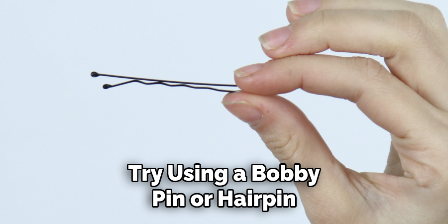 Try Using a Bobby Pin or Hairpin
