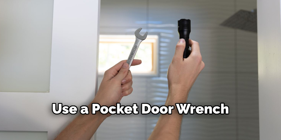 Use a Pocket Door Wrench