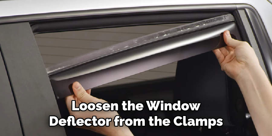 Loosen the Window Deflector from the Clamps