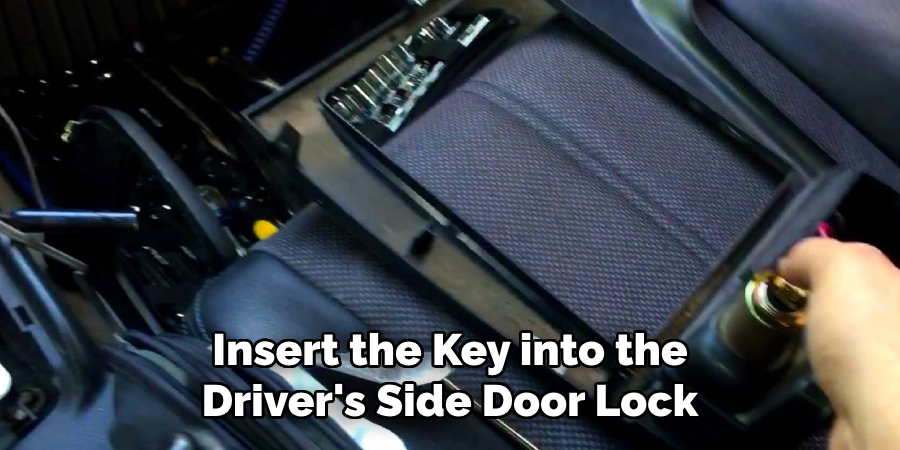 Insert the Key into the Driver's Side Door Lock