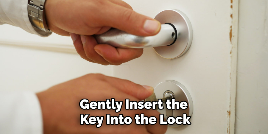 Gently Insert the Key Into the Lock