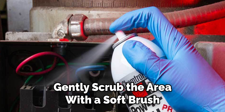 Gently Scrub the Area
With a Soft Brush