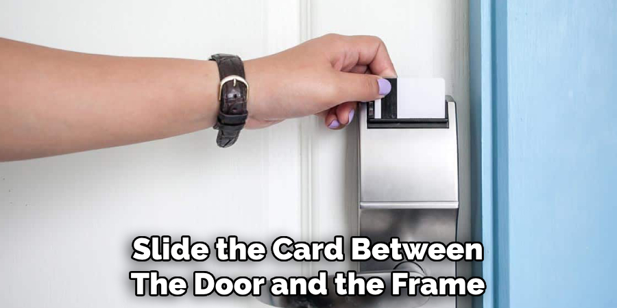 Slide the Card Between
The Door and the Frame