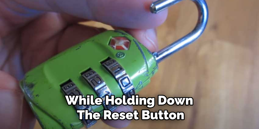 While Holding Down
The Reset Button