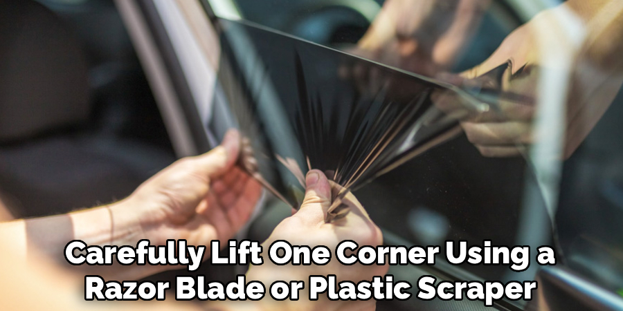 Carefully Lift One Corner Using a
Razor Blade or Plastic Scraper