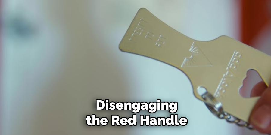 Disengaging the Red Handle