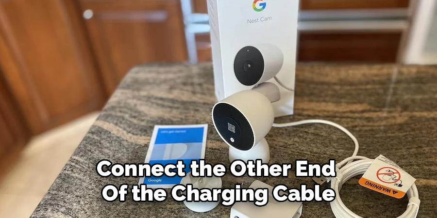 Connect the other end of the charging cable