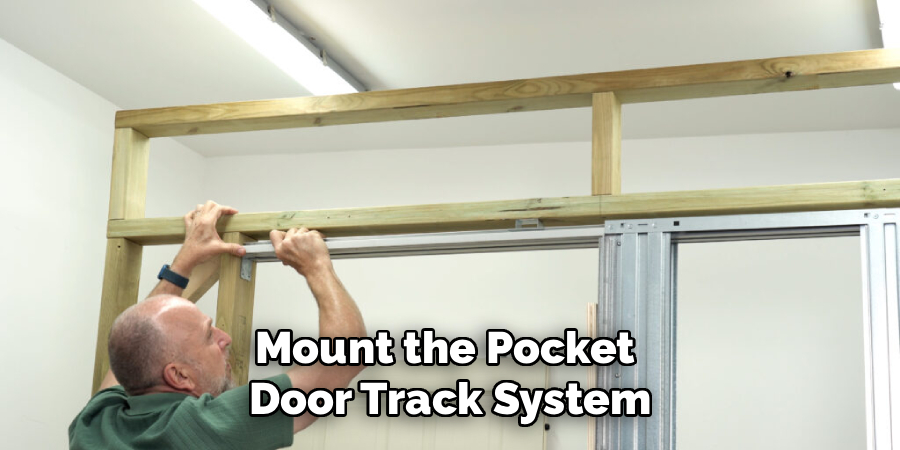 Mount the pocket door track system