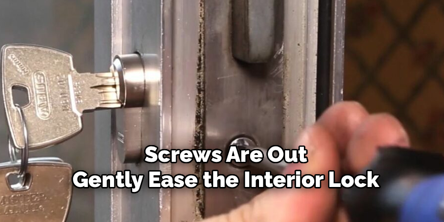 Screws Are Out 
Gently Ease the Interior Lock 