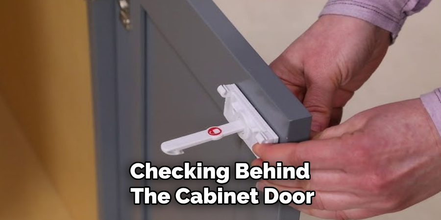Checking Behind
The Cabinet Door