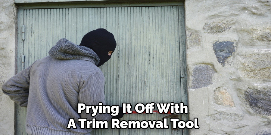 Prying It Off With 
A Trim Removal Tool 